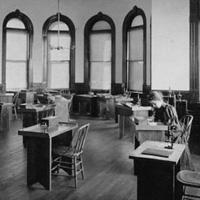 Female student in biology laboratory in Thompson Hall, c. 1904