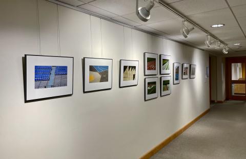 Photo gallery arranged along a hall in Dimond Library