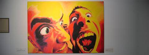 large colorful artwork of facial expressions 