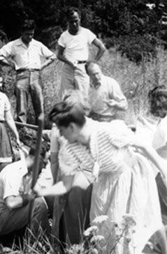 Students digging clay on campus