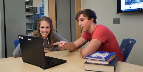 students collaborating in UNH Library