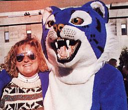 1991 wildcat mascot with women at a game