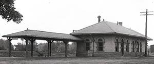 Dairy Bar and railroad station, taken by Clement Moran ca. 1917.
