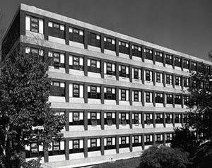 Kendall Hall with trees in foreground.