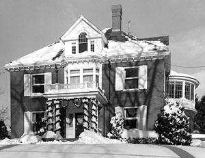 President's House covered in snow and decorated with garlands, December 1960.
