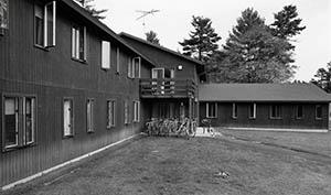 Woodruff House with bicycles under balcony.