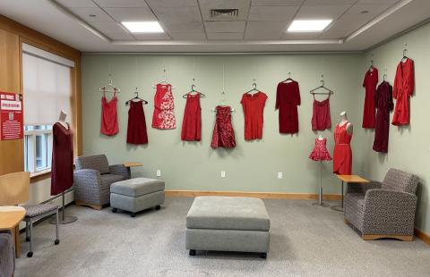A wall of hanging red dresses in Dimond Library for the No More Stolen Sisters exhibit